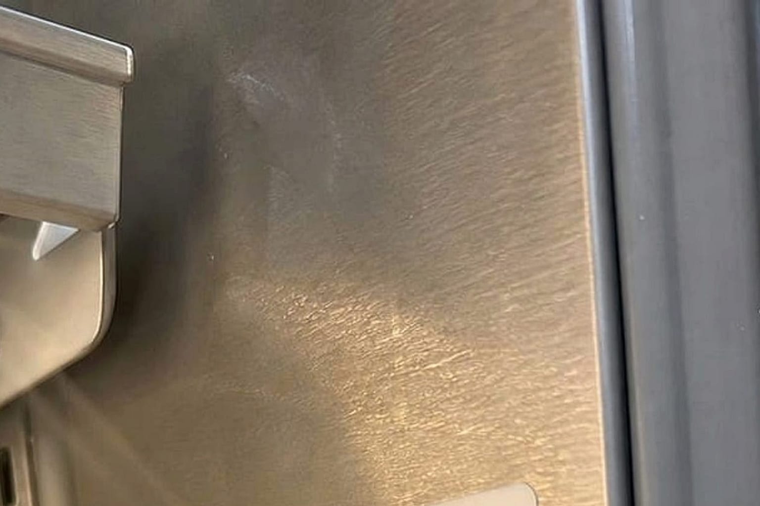 Worn magnetic door gasket on a built-in Sub-Zero refrigerator in a Walnut Creek kitchen
